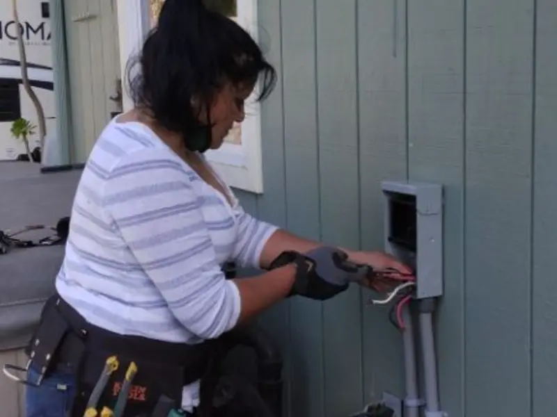 Licensed electrician wiring an exterior subpanel in Forest Glen